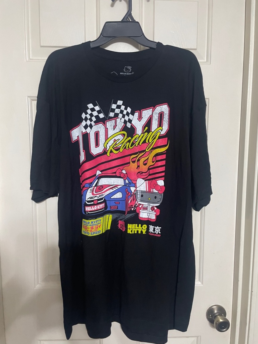 Unisex Hello Kitty Black Tokyo Racing Graphic Tee with Pink & Yellow Accents